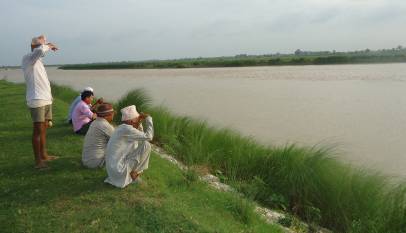 locals watching dolphins in Kailali
