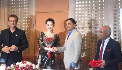 Xu Qing shaking hands with Tourism Minister Yogesh Bhattarai